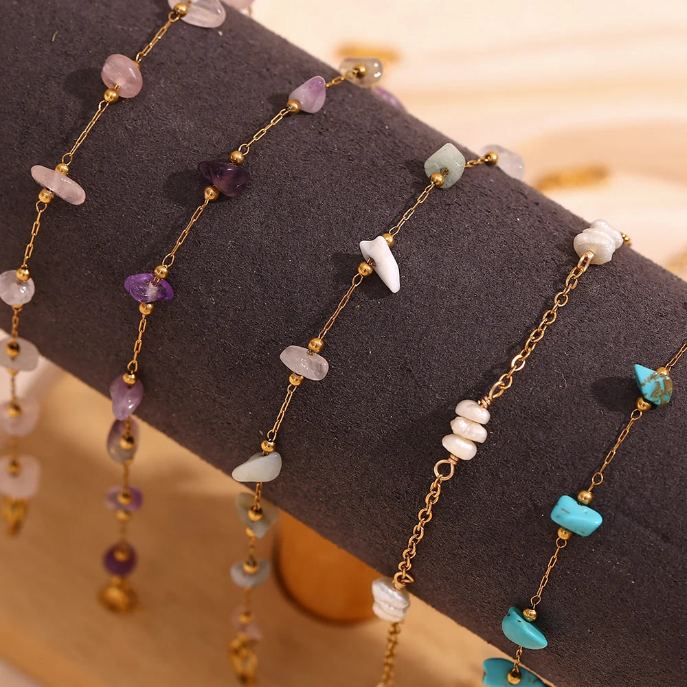Gold plated foot chains featuring various colored crushed stones like amethyst, quartz, and turquoise.