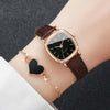 A women's fashion square leather watch set featuring a gold-toned watch with a black face and a matching heart pendant.