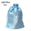 Light blue satin drawstring storage bag with a gathered top
