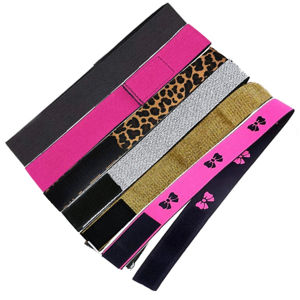 A collection of pink, black, and leopard print elastic bands for wig edges arranged diagonally.