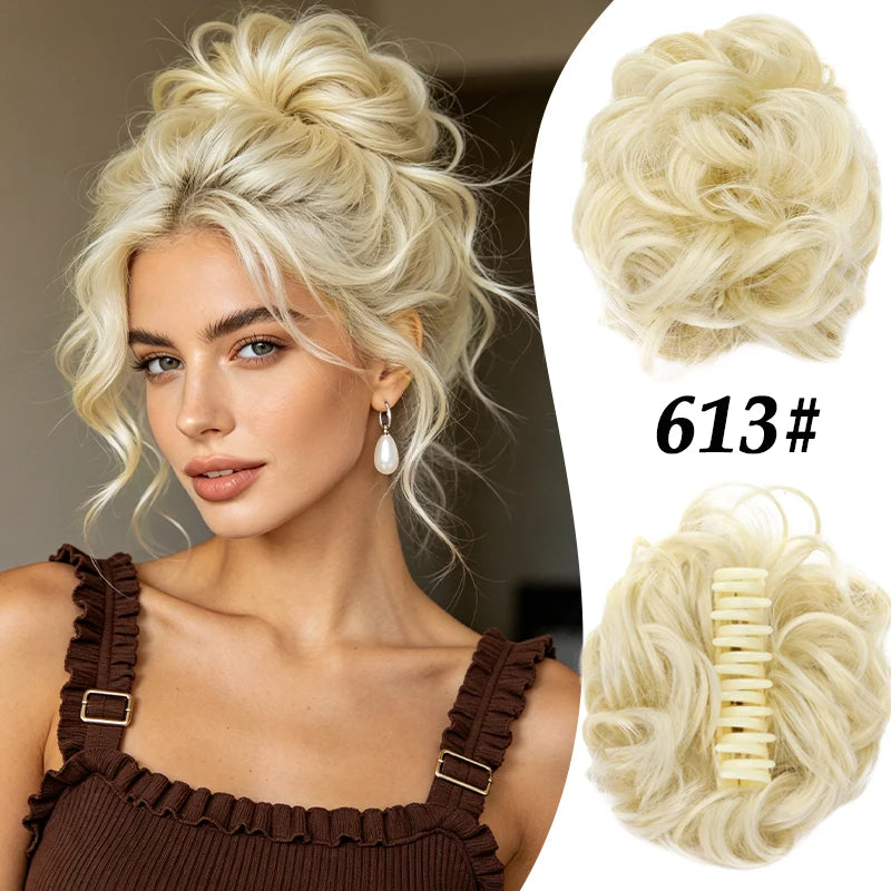 A blonde woman shows off a voluminous curly messy bun hairstyle with a hair accessory.