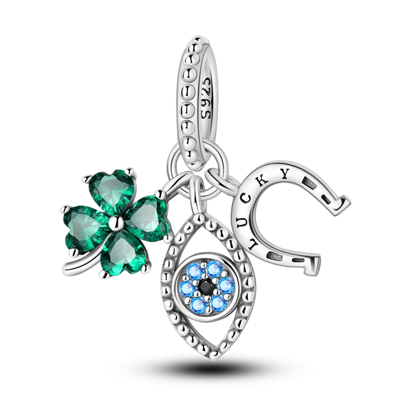 Sterling silver devil's eye charm bracelet featuring a clover and a blue gemstone pendant