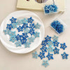 A collection of blue and light blue star-shaped hair clips displayed on a white plate and in a clear container.