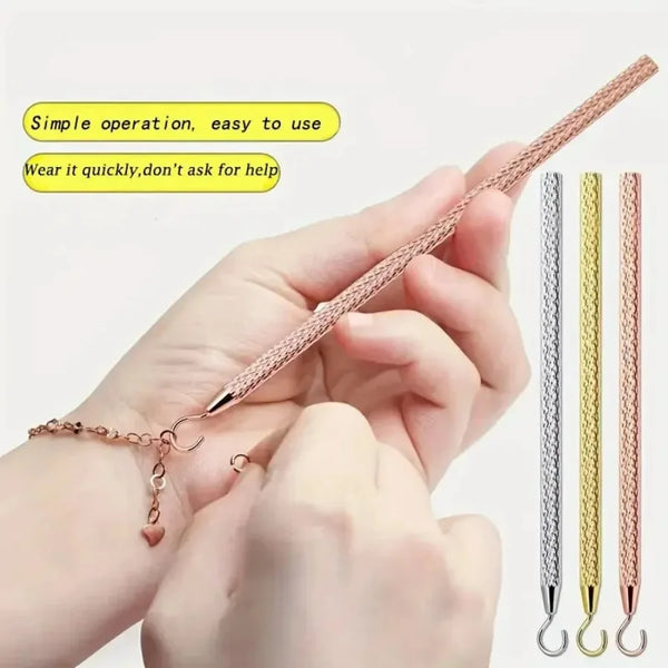 A hand is demonstrating a precision jewelry tool kit for clasps and closures, showing various colored tools.