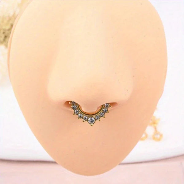 A set of six faux septum and nose rings displayed against a light peach-colored skin tone.