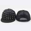 Black flat hat baseball cap adorned with silver rivets and a mesh back