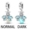 A pair of sterling silver devil's eye charm earrings in normal and dark finishes.