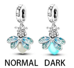 A pair of sterling silver devil's eye charm earrings in normal and dark finishes.