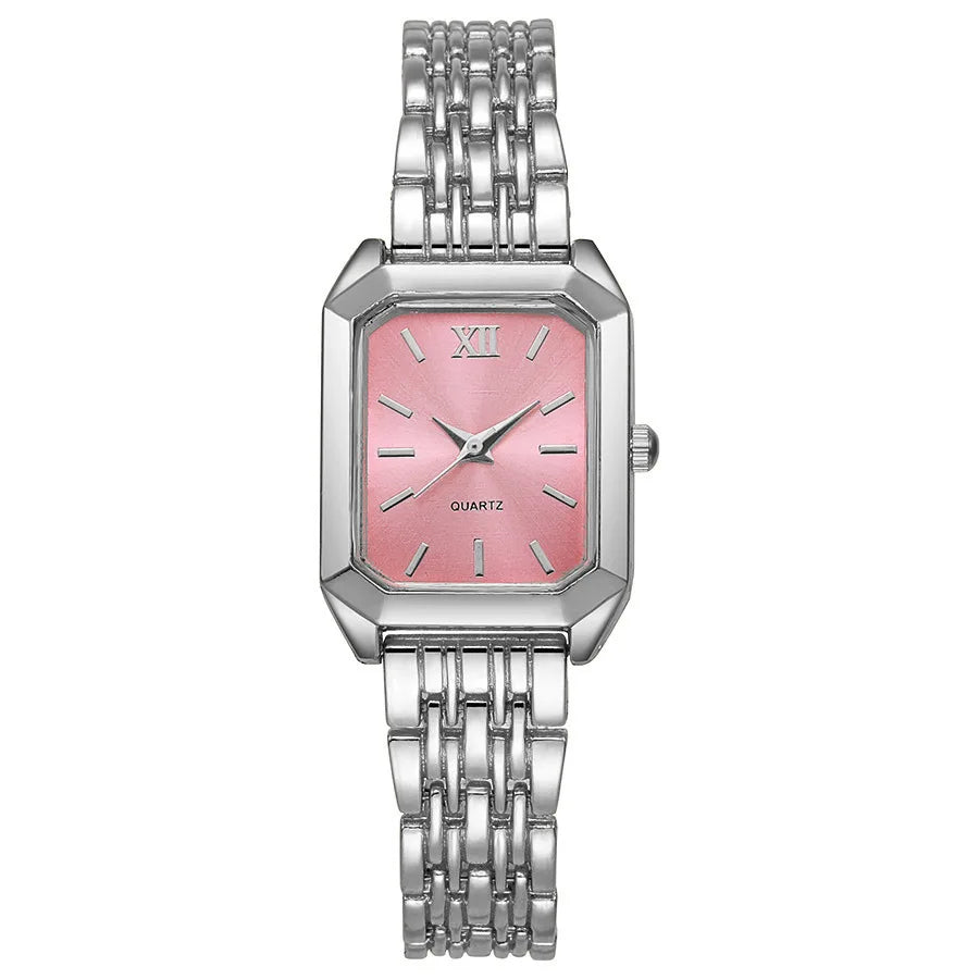A silver-toned minimalist quartz watch with a pink dial and stainless steel bracelet.