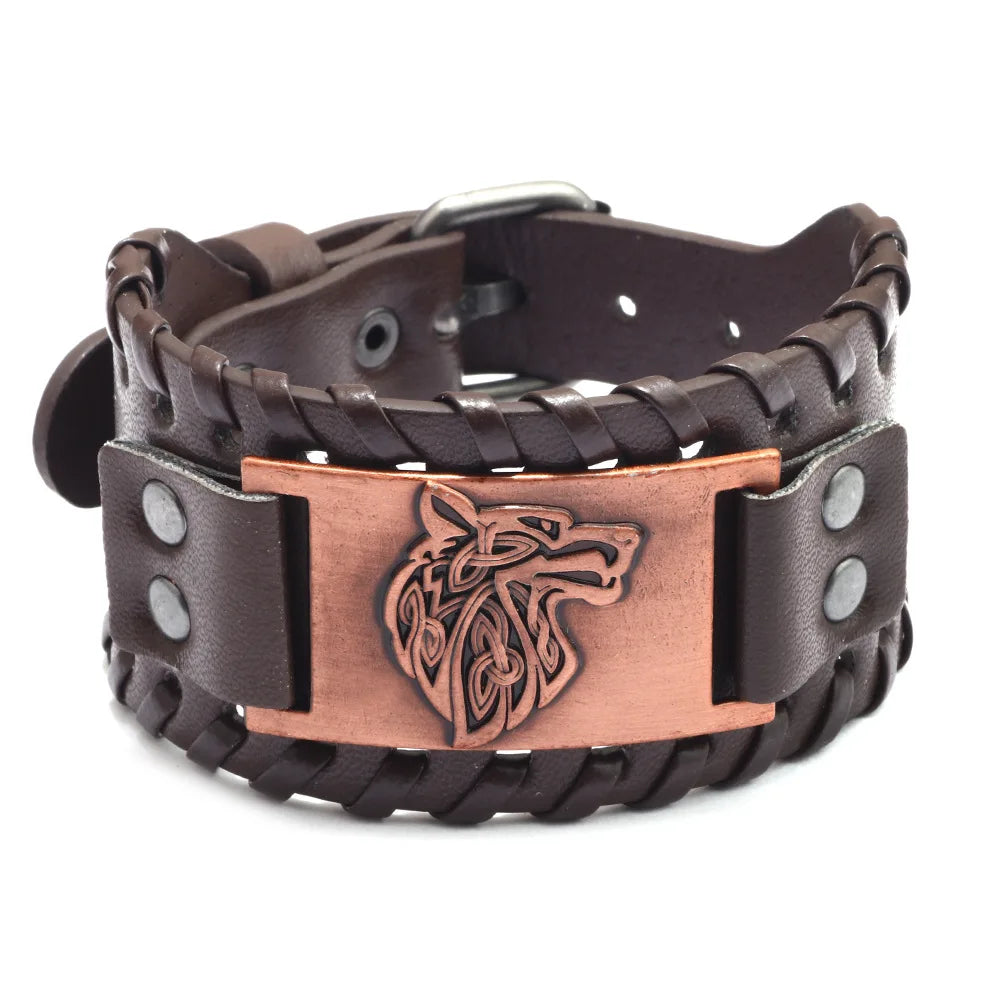 A dark brown leather bracelet with a woven texture and a bronze compass design.