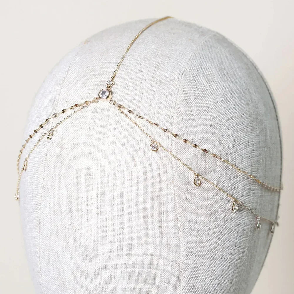 Gold crystal head chain for bridal hair accessories displayed on a mannequin