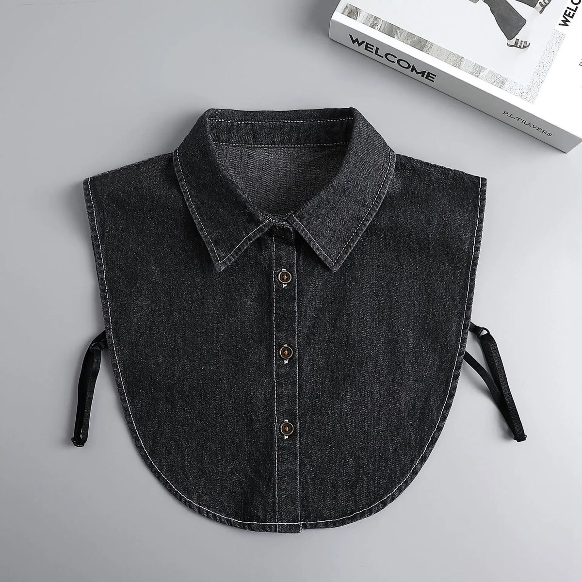 A dark gray button-up blouse with a false collar and detachable neckline shown flat lay.