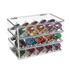 A clear plastic organizer with multiple compartments for storing eyeglasses and sunglasses.