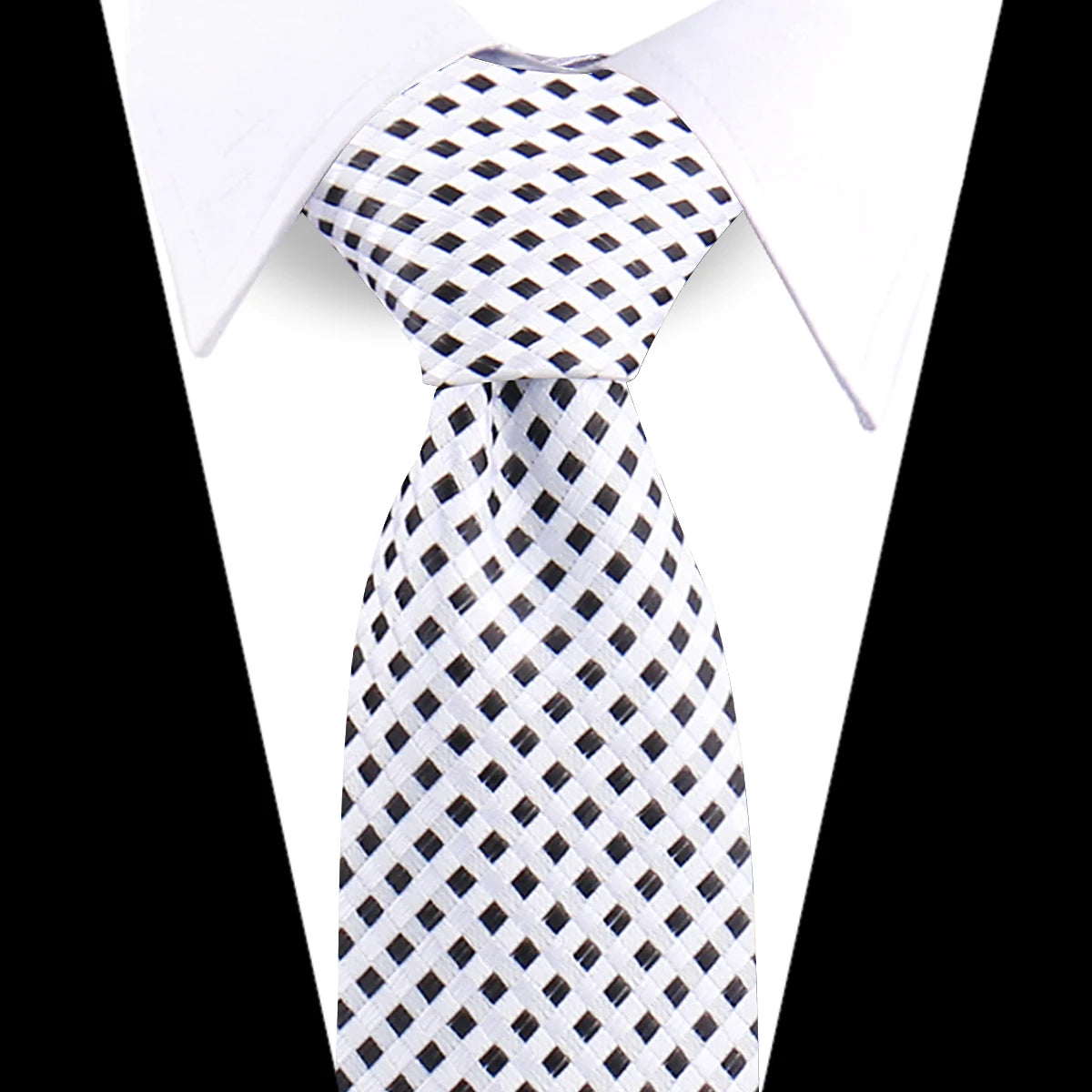 A white shirt with an elegant men's floral paisley silk necktie featuring a black and white checkered pattern.