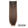 A bundle of long, straight, dark brown hair extensions with black hair ties.