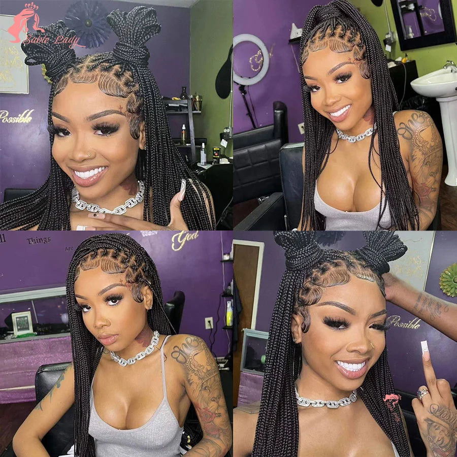 A woman modeling a 36 inch full lace box braids wig with gold jewelry and makeup.