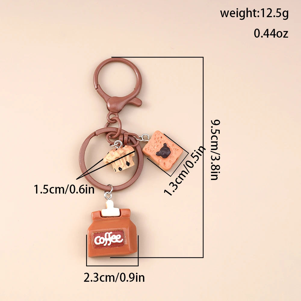 A brown classic coffee keychain featuring a small square coffee bean charm and a rectangular coffee tin component.