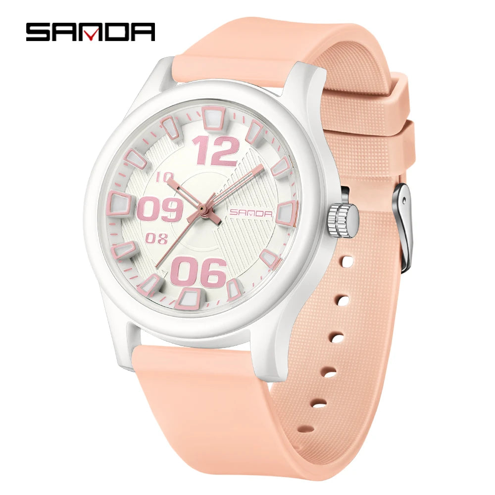 A pink and white classic quartz fashion watch with a silicone strap shown on a white background.