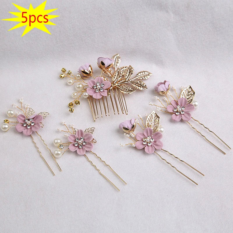 A set of five floral pearl bridal hair accessories featuring pink flowers and gold leaves.