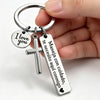 A silver stainless steel couple keychain featuring a 'I love you' charm and a cross pendant.