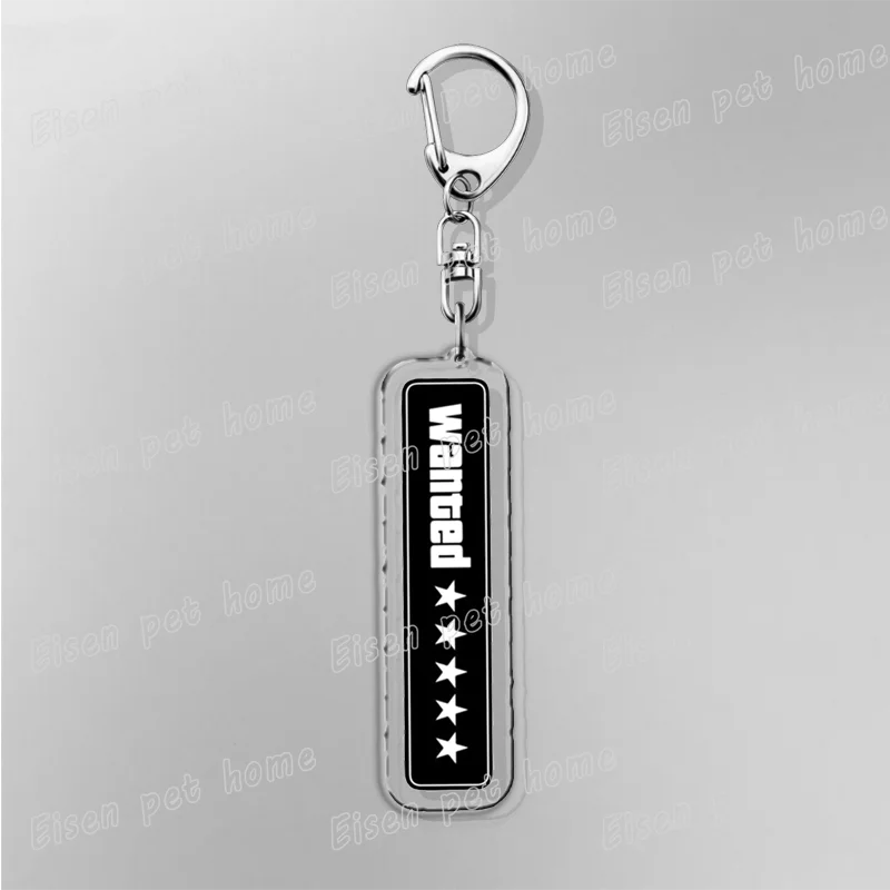 Silver pendant keychain with a rectangular black charm featuring the word Wanged and five stars.