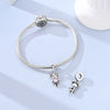 Sterling silver devil's eye charm bracelet with a round bead and a small charm pendant