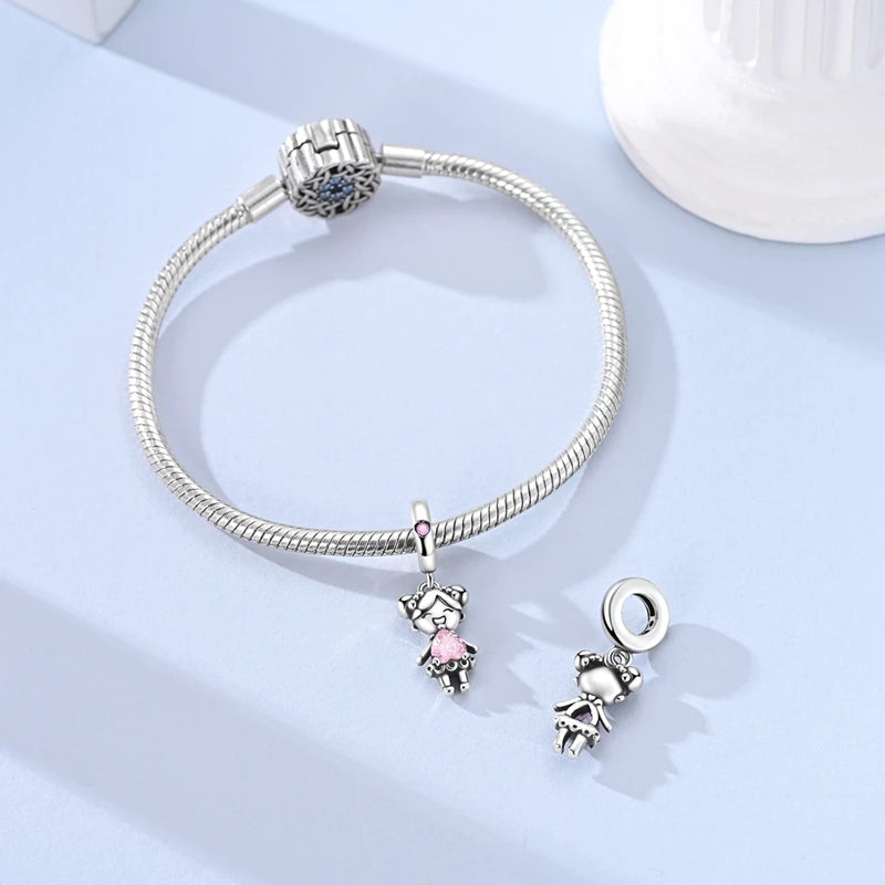 Sterling silver devil's eye charm bracelet with a round bead and a small charm pendant