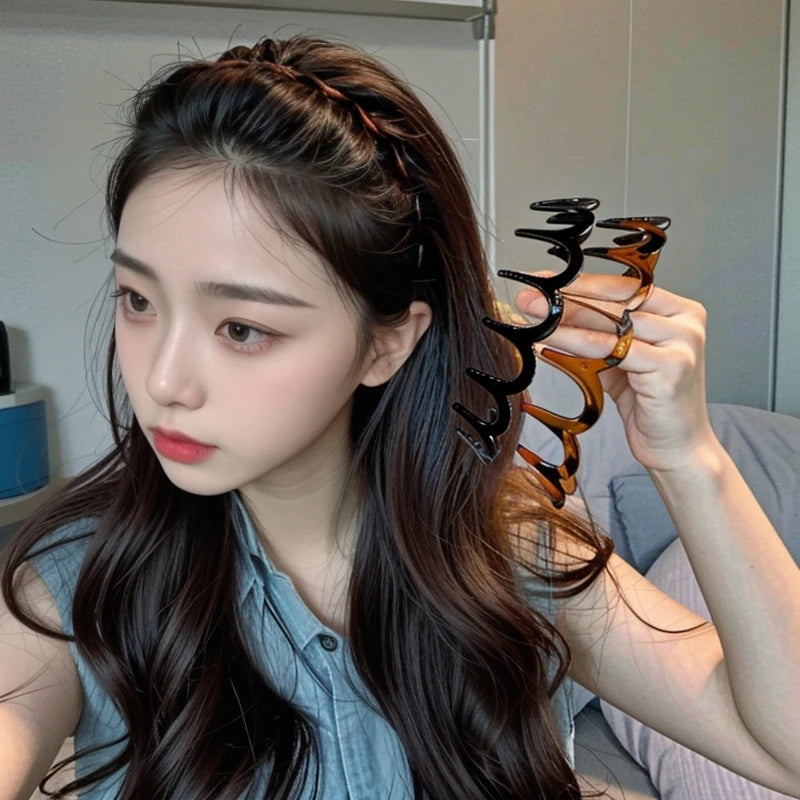 A close-up of a woman with long dark hair wearing a brown resin wave toothed headband.