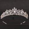 A sparkling Baroque crystal bridal crown displayed against a dark background.