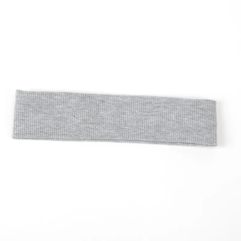 A gray knitted elastic headband for hair and face.