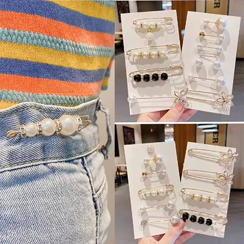 A display of pearl and black bead brooch pins for customizing apparel shown against a denim background.
