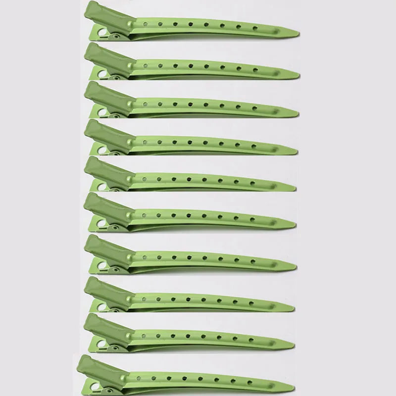 A vertical arrangement of professional fixed hair pins in a light green color.