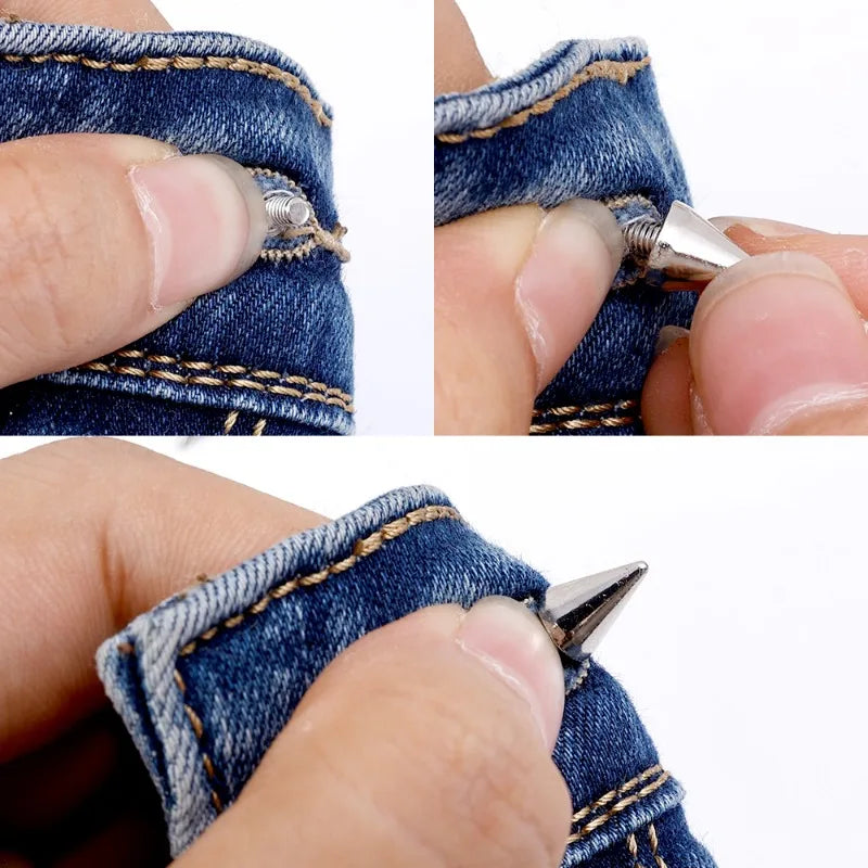 Close-up of a hand using a tool to install punk rock bullet rivets into denim fabric.