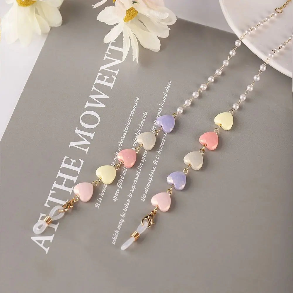 A delicate fashion pearl beaded eyewear chain featuring pastel colored beads and gold accents.