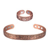 A set of vintage flower engraved copper bracelets and rings.