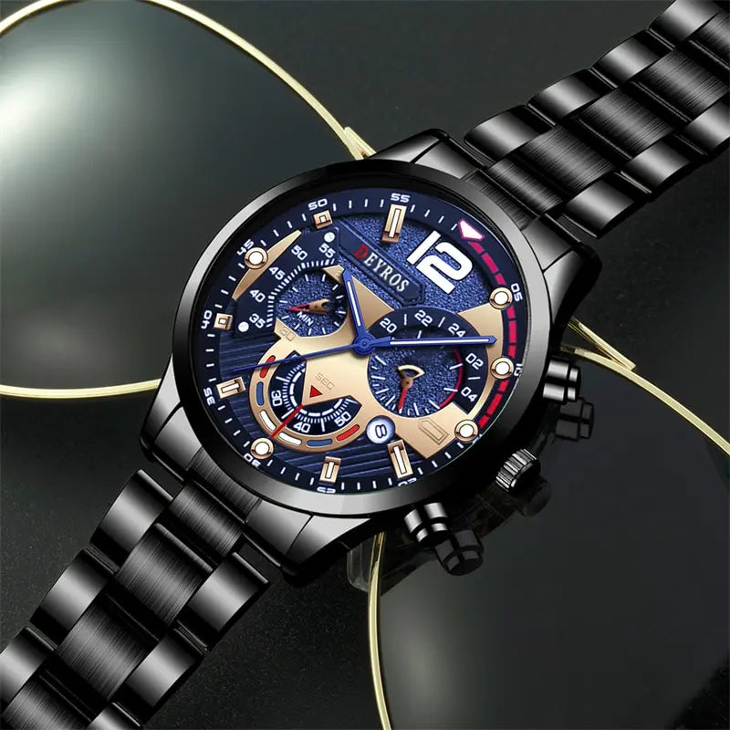A close-up shot of a black men's stainless steel quartz watch with a blue dial and black strap, resting on a dark surface.
