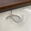 Transparent acrylic hair claw used for styling ponytails or hair