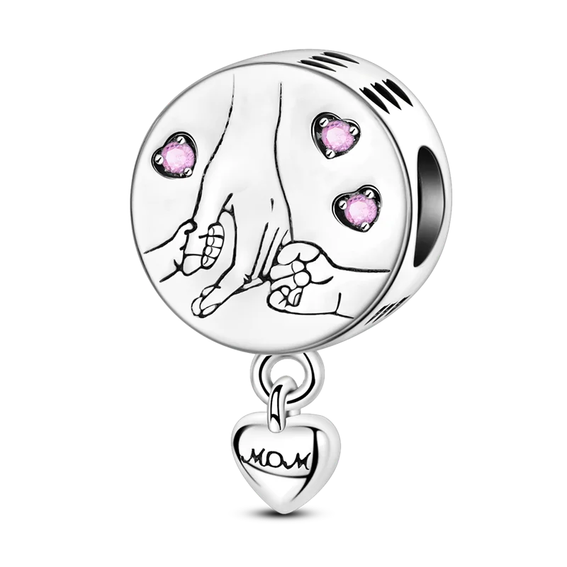 Sterling silver devil's eye charm bracelet featuring a round charm with pink stones and a heart pendant.