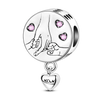 Sterling silver devil's eye charm bracelet featuring a round charm with pink stones and a heart pendant.