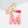 Alphabet letter M acrylic keychain with pink butterfly charm and pink tassel