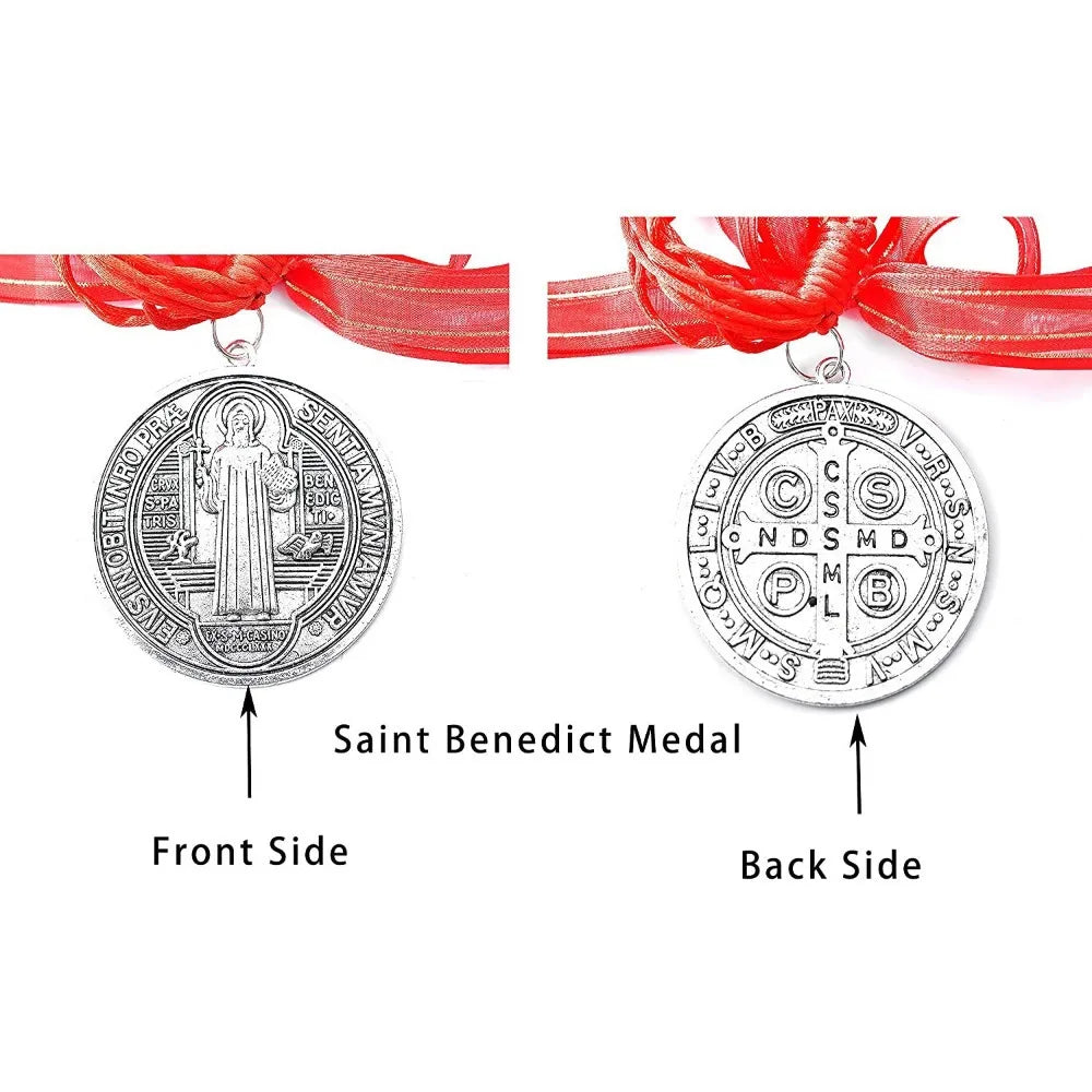 Silver Saint Benedict medal showing the front and back sides with red ribbon