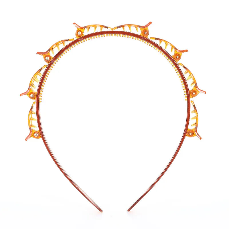 A round, orange braided hair headband clip with decorative elements.