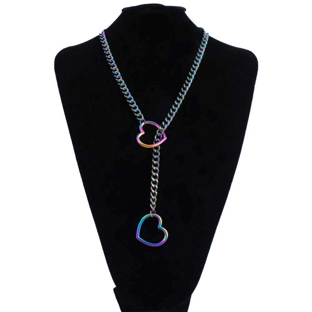 A silver-colored chunky heart slip chain necklace displayed on a black velvet display stand.