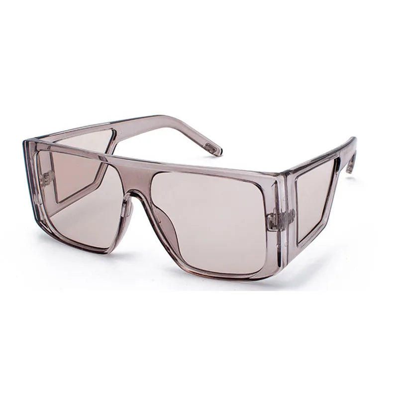 A pair of oversized gradient square sunglasses with a light pink tint and clear plastic frames.