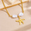 Gold chain necklace with a pearlescent heart pendant and a starfish charm on a light background.