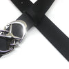 A black leather belt with a silver vintage gothic moon star buckle, shown crossed.