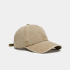 A beige washed cotton snapback cap shown from the side.