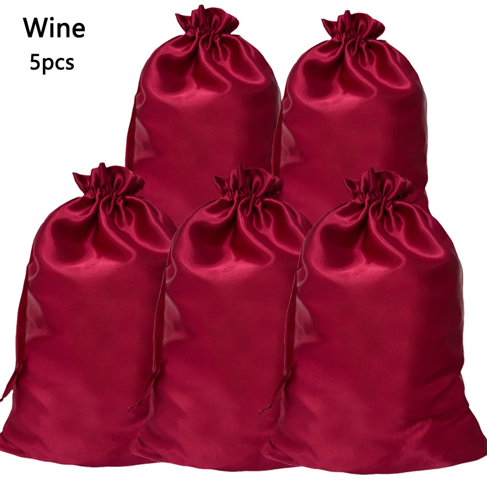 Five deep red satin drawstring storage bags for hair tools