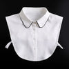 A white blouse with a fashionable false collar and detachable neckline, shown against a black background.