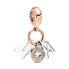 Rose gold cherry blossom charm pendant with a textured bead and a clear diamond-encrusted letter charm